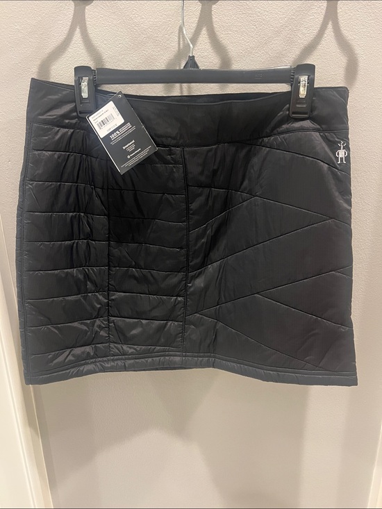 Smartwool Dresses & Skirts - Smartwool Black Quilted Mini Skirt with Logo Detail